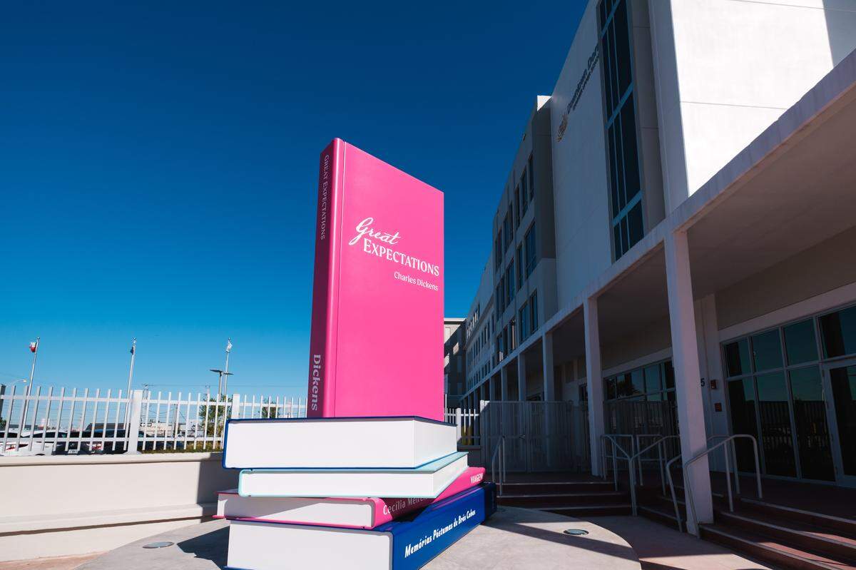 Faculty and staff at Downtown Doral Charter Upper School recently unveiled a nearly 12-foot tall sculpture of books that sits at the main entrance of the school. The purpose of the sculpture is to emphasize the school’s commitment to literature, global education and the arts.