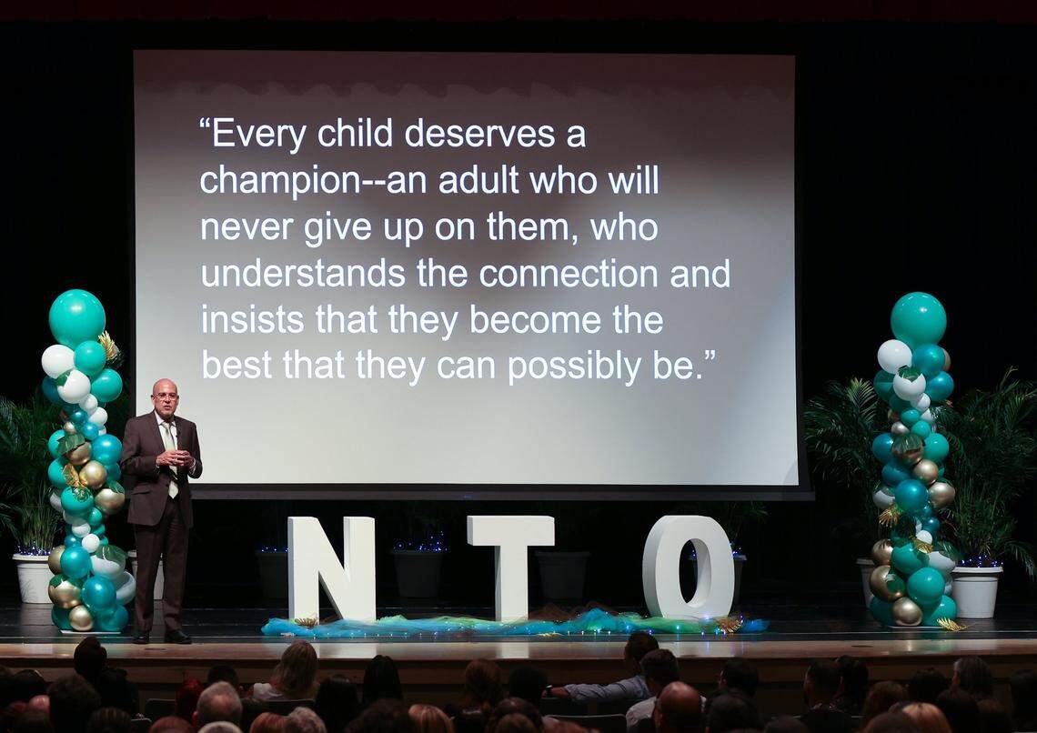 Miami-Dade Schools superintendent Jose Dotres stands in front of an inspirational message shown to about 450 new teachers at the new teacher orientation at Hialeah Gardens Senior High on Monday, Aug. 7, 2023.