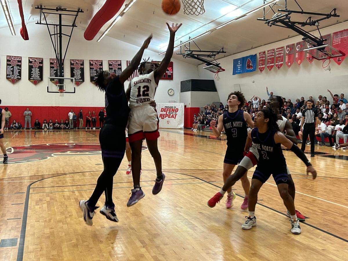 Sagemont guard Devontae Jean goes up for a shot during Friday’s Region 4-2A championship game at the Lions’ gym.