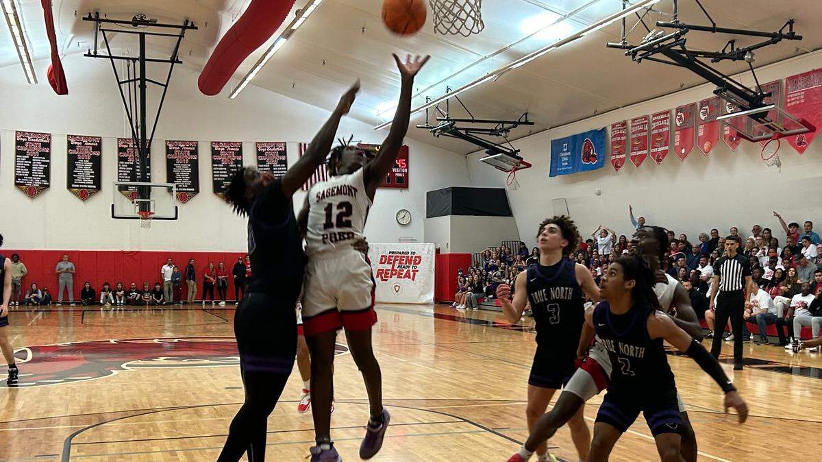 Sagemont guard Devontae Jean goes up for a shot during Friday’s Region 4-2A championship game at the Lions’ gym.