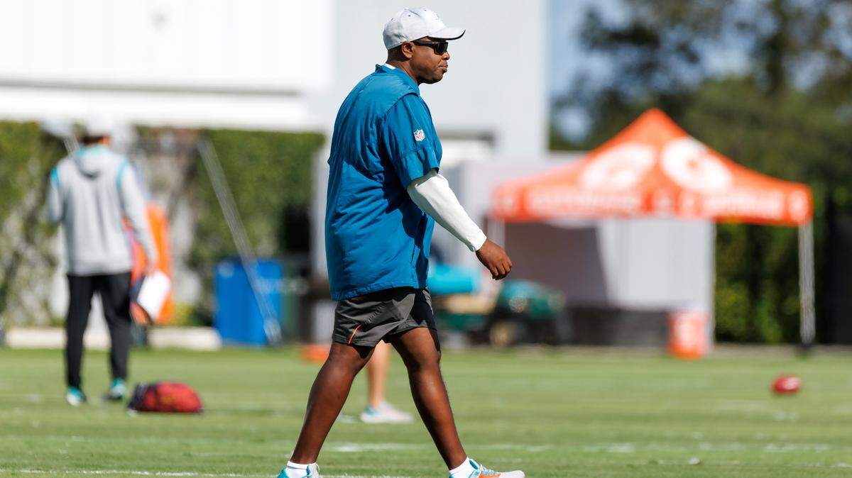 Miami Dolphins general manager Chris Grier walks on the field during practice at Baptist Health Training Complex in Hard Rock Stadium on Wednesday, December 28, 2022 in Miami Gardens, Florida.