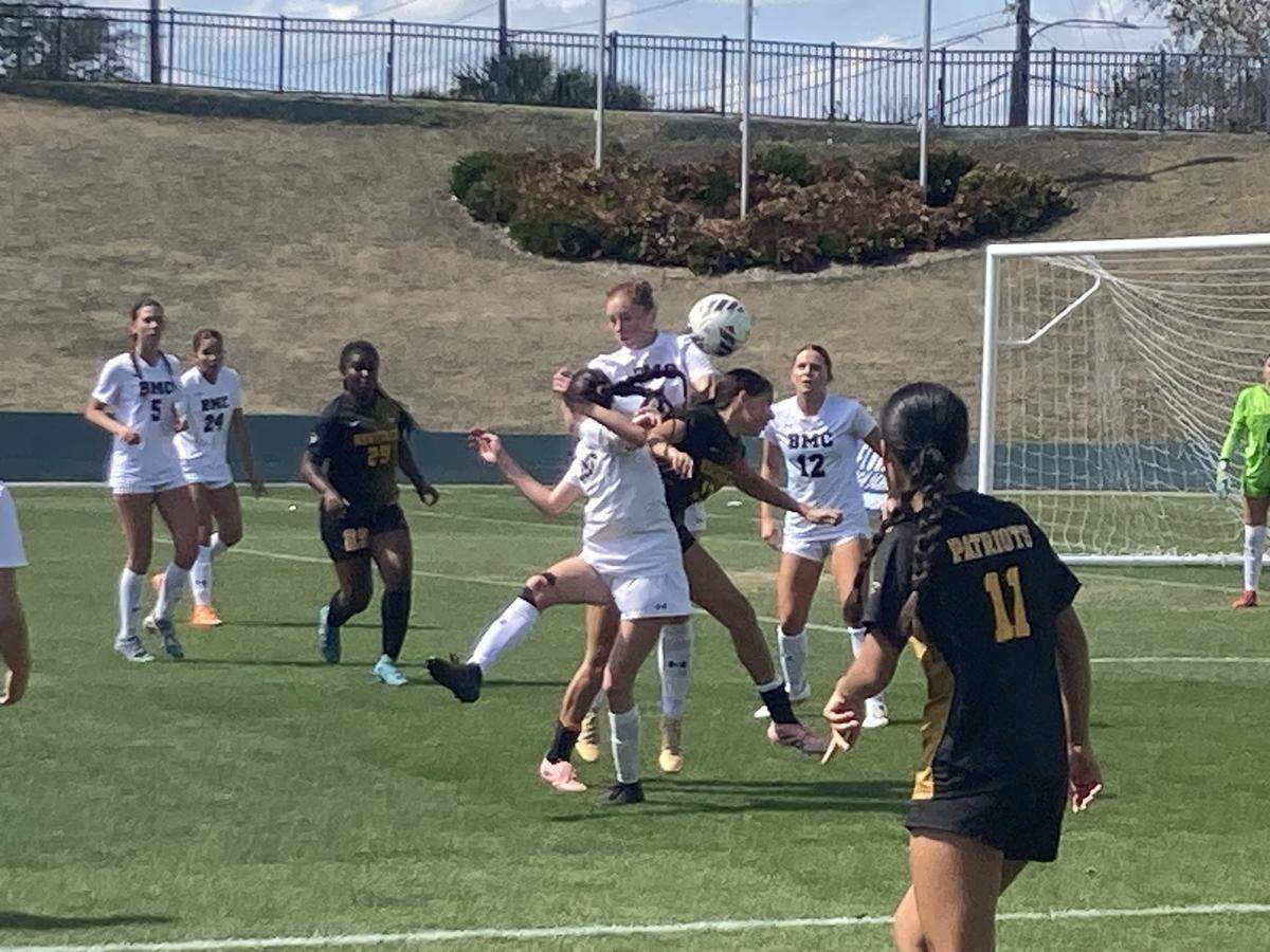 American Heritage and Orlando Bishop Moore players go up to head the ball during their Class 4A state girls’ soccer semifinal on Thursday afternoon at Spec Martin Stadium in DeLand, Fla.