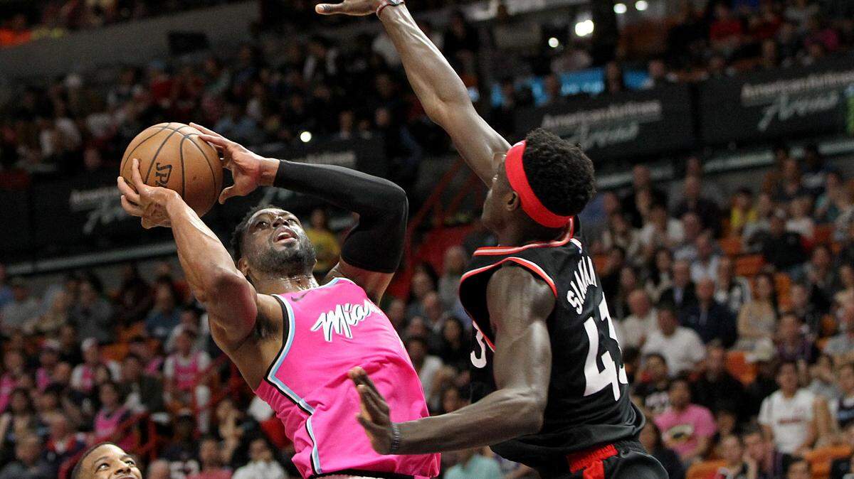 Heat guard Dwyane Wade shoots against Raptors’ Raptors’ forward Pascal Siakam in a game this past Wednesday. Wade’s acquisition from Cleveland was the best personnel move by a South Florida team in 2018.