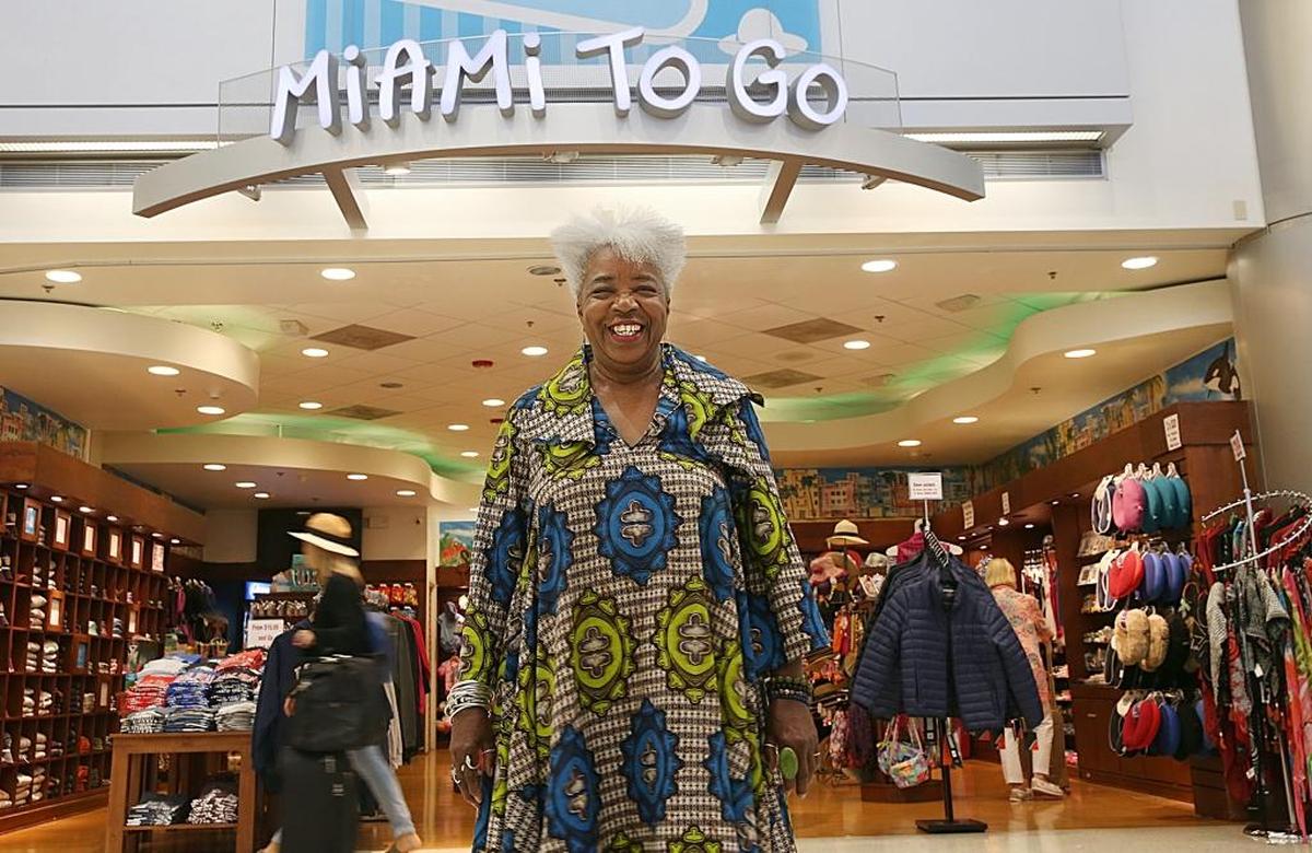 Carole Ann Taylor, founder and owner of Cultures to Go, in front of her store Miami To Go at Miami International Airport, on Aug. 4. Taylor is the proprietor, the president and co-owner of several successful travel, culture and destination retail businesses in Little Havana and at MIA.