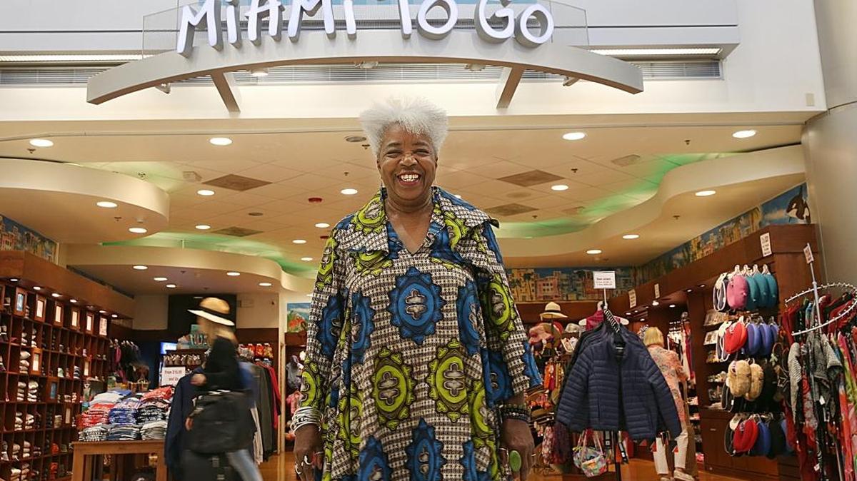 Carole Ann Taylor, founder and owner of Cultures to Go, in front of her store Miami To Go at Miami International Airport, on Aug. 4. Taylor is the proprietor, the president and co-owner of several successful travel, culture and destination retail businesses in Little Havana and at MIA.