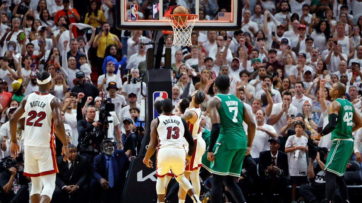 Boston Celtics guard Derrick White (9) scores the game-winning basket against the Miami Heat in Game 6 of the Eastern Conference finals at the Kaseya Center in Miami on Saturday, May 27, 2023.