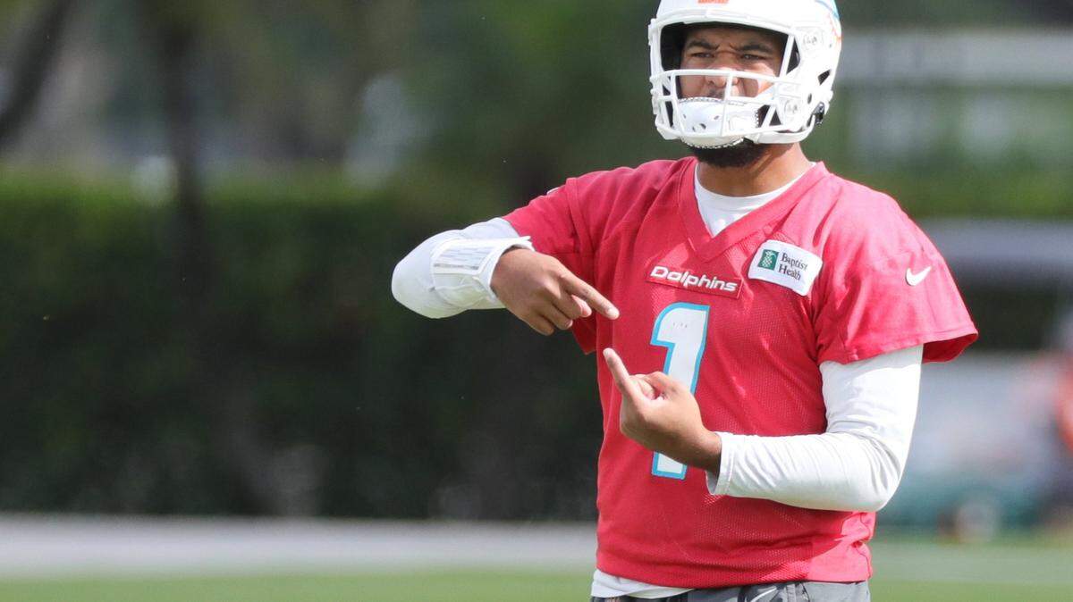 Miami Dolphins quarterback Tua Tagovailoa (1) gestures during practice at Baptist Health Training Complex in Miami Gardens on Thursday, December 30, 2021.