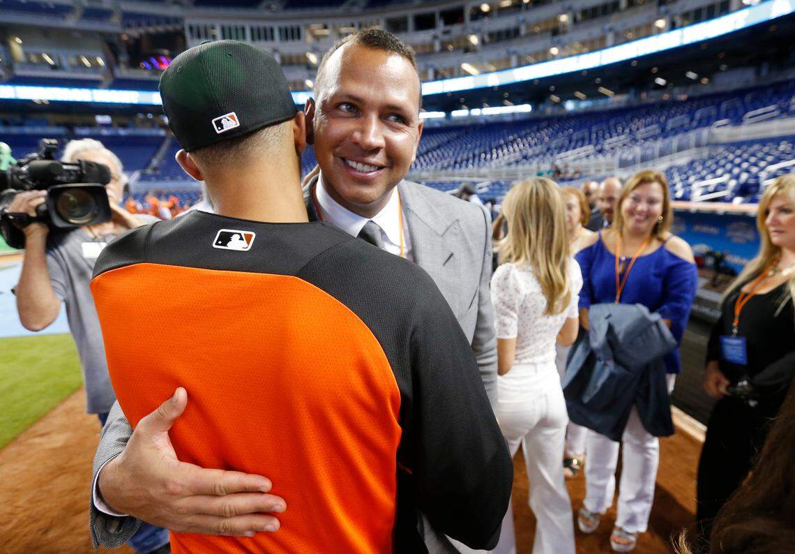 Joe Dunand, left, is hugged by his uncle, now-retired baseball player Alex Rodriguez, before being introduced as one of the Miami Marlins' top three draft picks at Marlins Park stadium on June 23, 2017, in Miami.