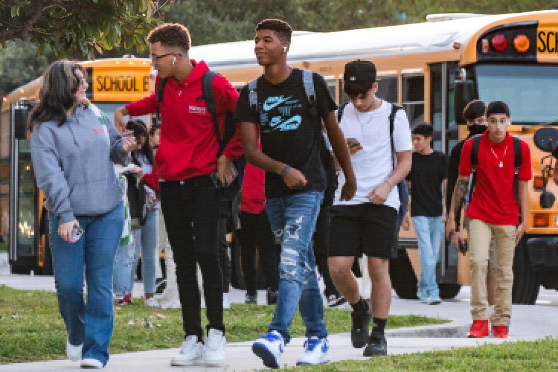 Students enter campus from the bus loop on the first day of school at Miami Beach High in Miami Beach, Florida, on Aug. 17, 2022.