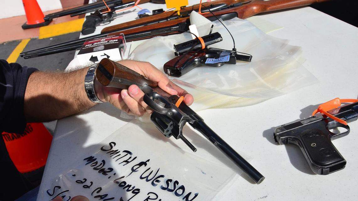 Miami police officer Roberto Buigues logs the serial number of an unloaded revolver that was being turned in during a gun buy-back event on Dec. 21, 2013, in Miami.
The event was the last one of the year in efforts to reduce gun violence, the first one of the year brought in 130 over pistols, rifles, shotguns and semi-automatic assault weapons. All the weapons collected will be destroyed