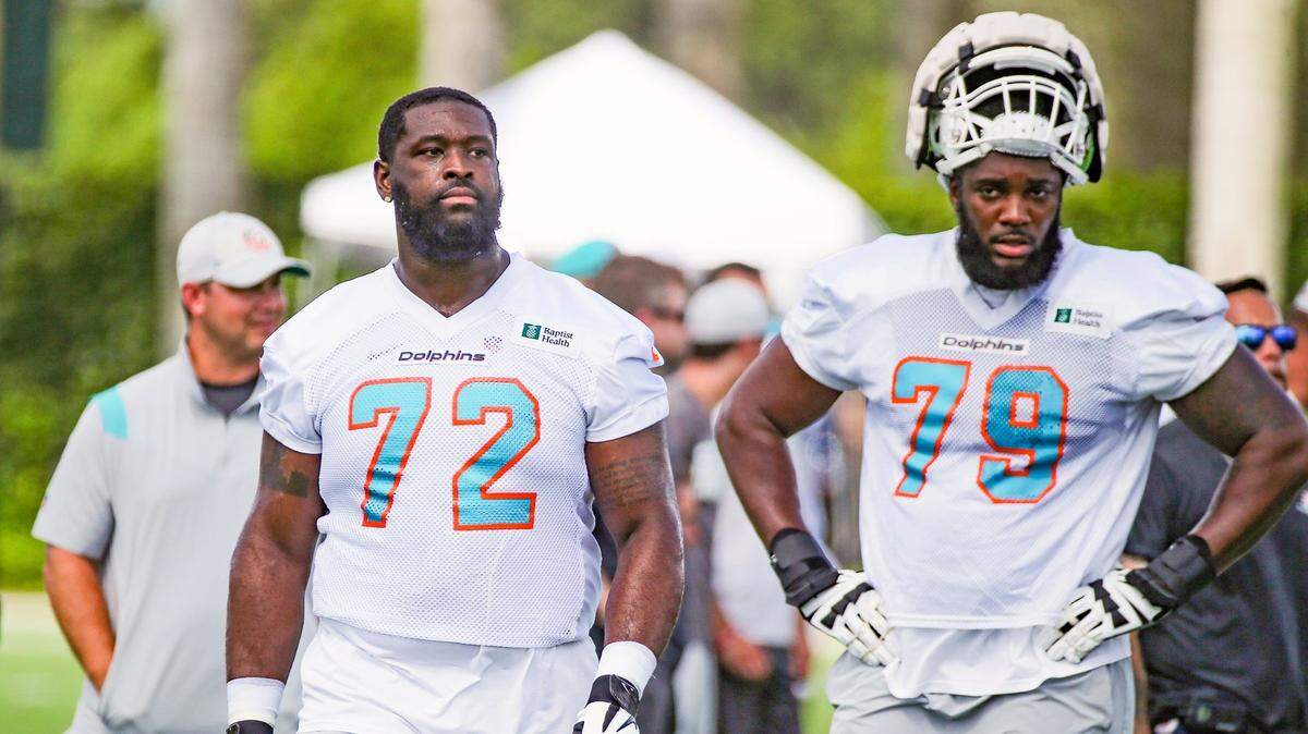 Miami Dolphins tackles Terron Armstead (72) and Larnel Coleman (79) look on during practice at Baptist Health Training Complex in Miami Gardens on Friday, July 29, 2022.