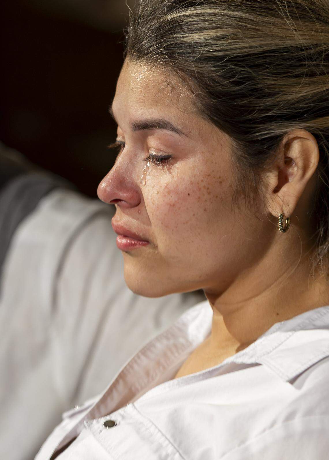 Laura cries as she attends a vigil at Christ Lutheran Church on Saturday, Aug. 9, 2025, in Oakland Park, Fla. Laura, who is undocumented, has a 13-year-old son and was recently diagnosed with terminal cancer, watched two months ago as her husband, Luis, was detained by ICE and taken to a detention center in Louisiana. The vigil brought together immigrant families and others supporting loved ones in migrant detention centers, such as Alligator Alcatraz, across the state and country.