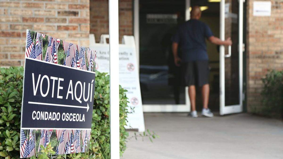 Voter enters an Osceola County polling station during early voting in Kissimee, Florida.