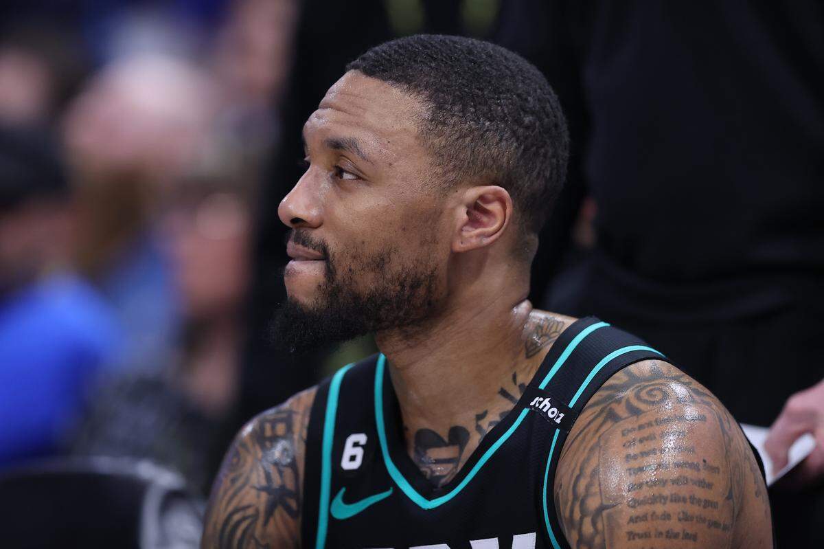 Portland Trail Blazers guard Damian Lillard (0) looks on during a time out against the Utah Jazz in the third quarter at Vivint Arena.