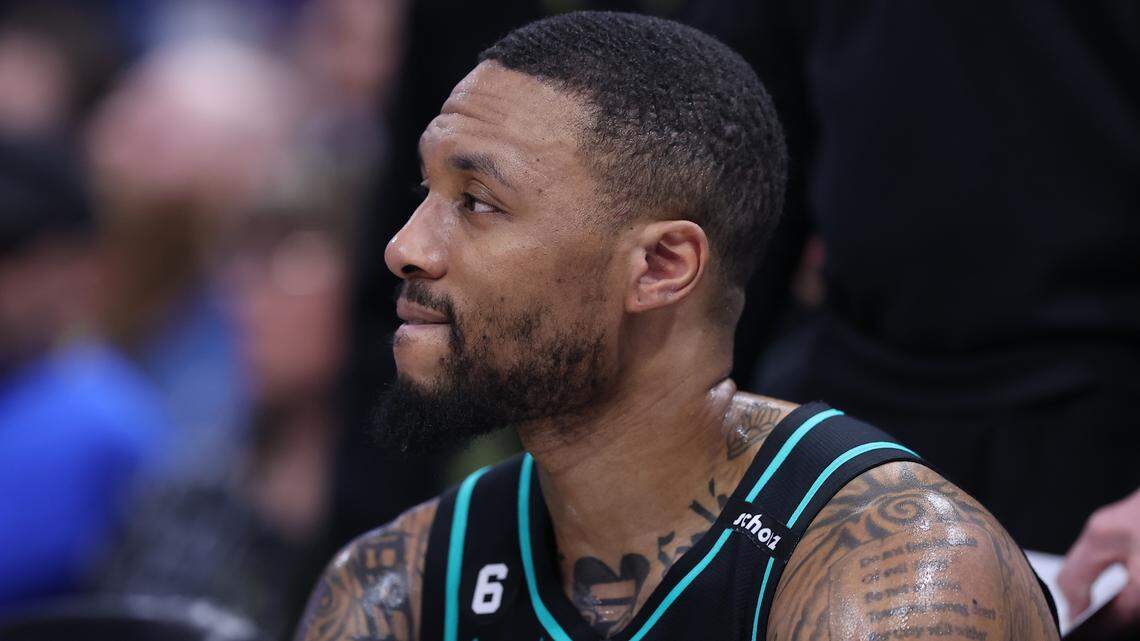 Portland Trail Blazers guard Damian Lillard (0) looks on during a time out against the Utah Jazz in the third quarter at Vivint Arena.