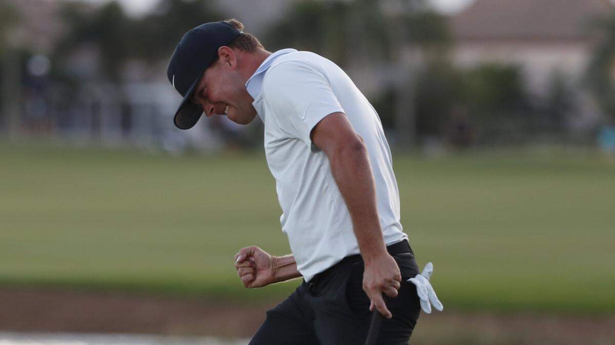 Keith Mitchell celebrates as he sinks his putt on the 18th hole to win the final round of the Honda Classic golf tournament, Sunday, March 3, 2019, in Palm Beach Gardens, Fla.