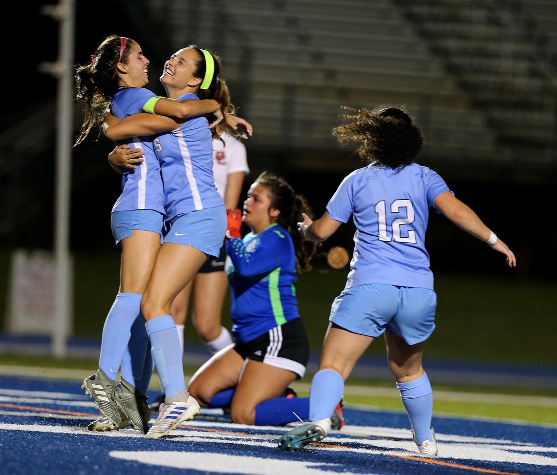 Lourdes players celebrate Mia Atrio # 3, goal to tie the game 1-1 against Cooper City during he first half of the girls soccer regional final match at Tropical Park, in Miami on Tuesday February 18, 2020.