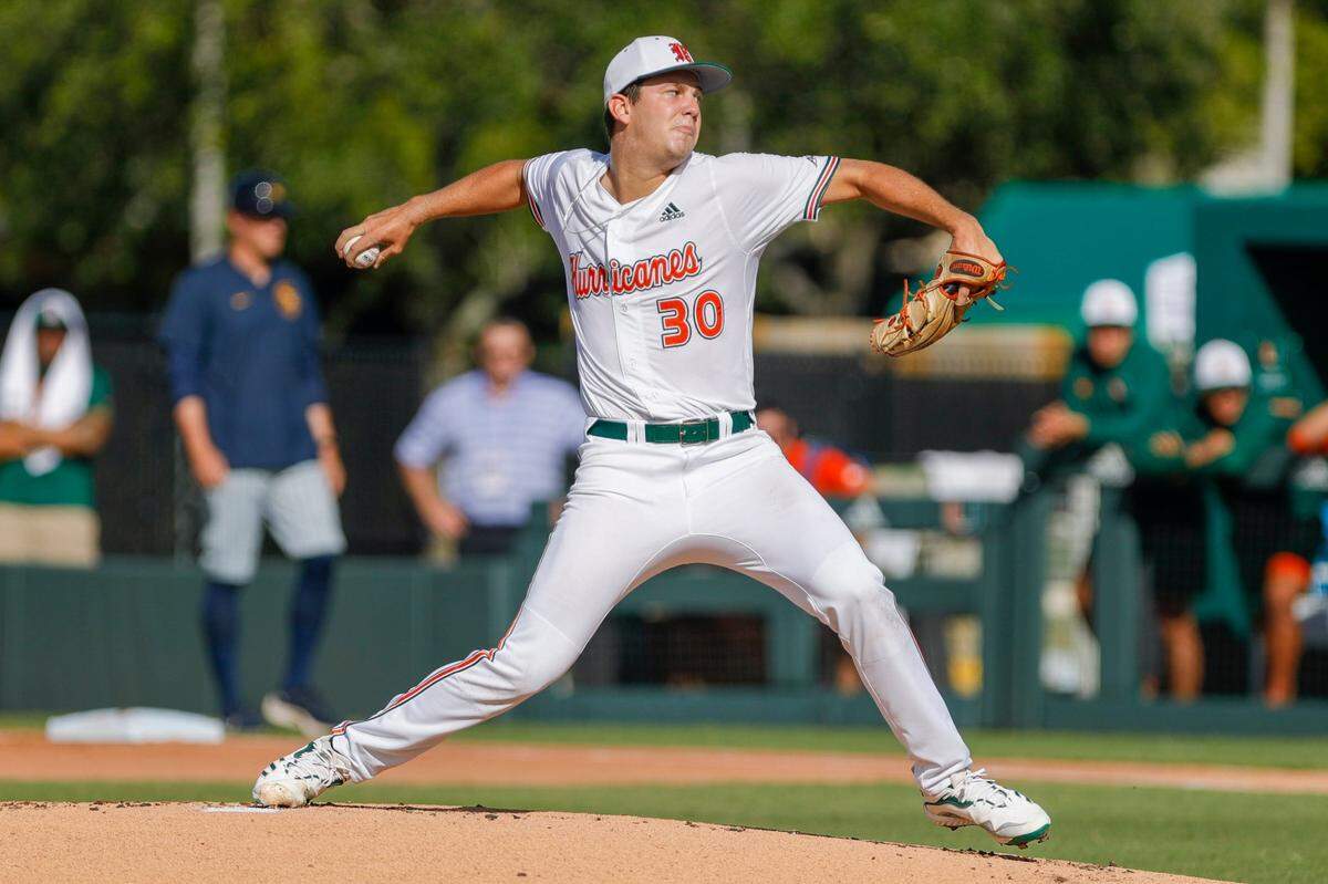 Miami Hurricanes pitcher Karson Ligon (30) delivers a pitch during the first inning of the Coral Gables NCAA baseball regional game against the Canisius Golden Griffins at Alex Rodriguez Park at Mark Light Field in Coral Gables, Florida, Saturday, June 4, 2022.