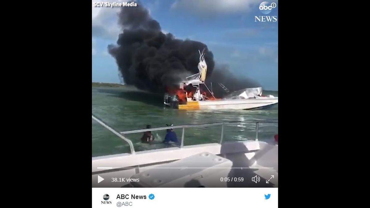 Video from a nearby vessel shows the tour boat in flames with black smoke erupting from where the vessel's engines are located.