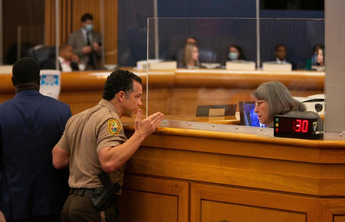 Freddy Ramirez, then the director of the Miami-Dade Police Department, speaks to county Mayor Daniella Levine Cava during a June 2021 County Commission meeting.