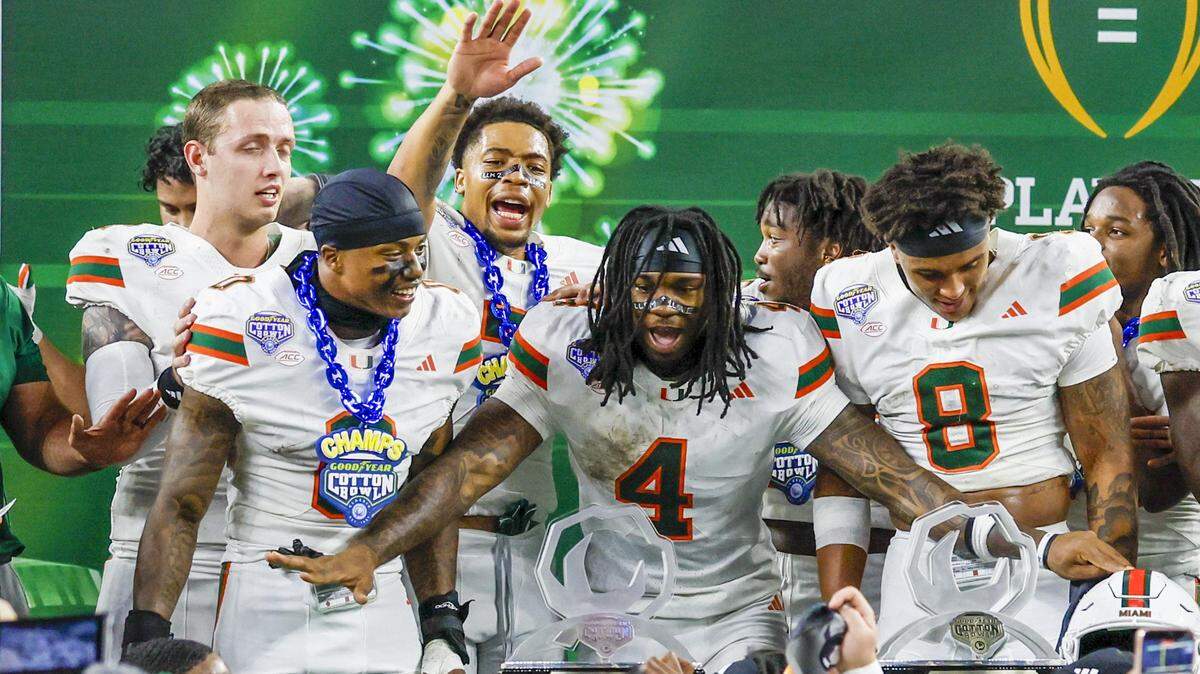 Miami Hurricanes running back Mark Fletcher Jr. (4) wins the Outstanding Offensive Player Trophy after the Canes defeat Ohio State Buckeyes in the College Football Playoff quarterfinal game in the Cotton Bowl at AT&T Stadium in Arlington, Texas on Thursday, January 1, 2026.