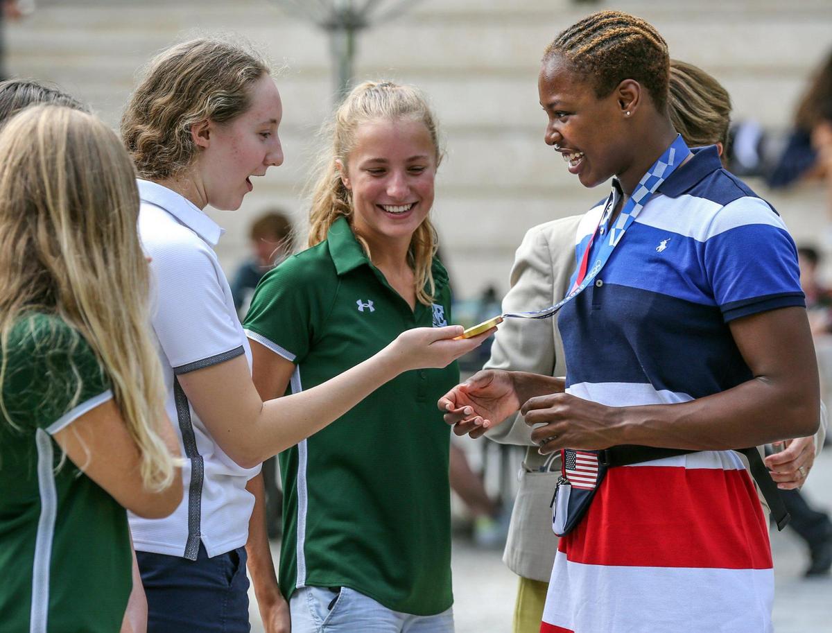 Ransom Everglades School students, and water polo team members, Chloe Alfonso and Sabrina Shipley meet with Ashleigh Johnson as they view her Olympic Gold Medal. Johnson, a two-time Olympic champion in water polo and a 2012 graduate of Ransom Everglades, returned to her high school and met with current students and toured the campus on Thursday, October 7, 2021. Johnson, considered the worlds best female water polo goaltender, helped the U.S. Olympic womens water polo team to a second straight gold medal at the 2021 Summer Games in Tokyo. At Ransom Everglades, she won four state titles in water polo.