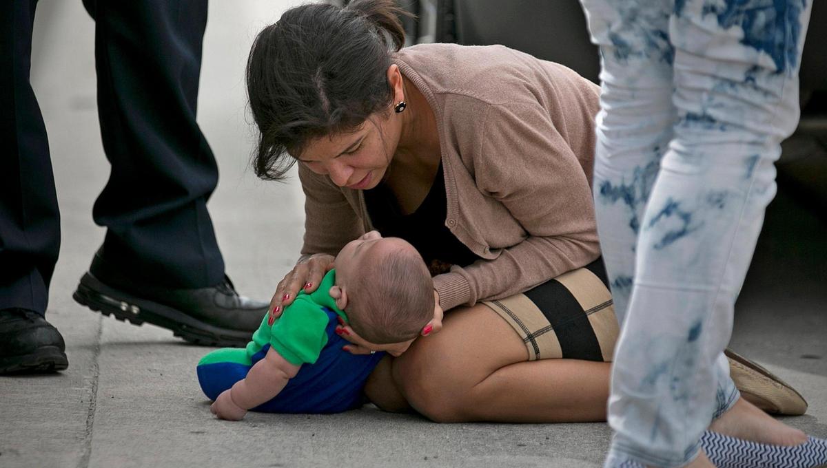 Pamela Rauseo, 37, checks on her nephew after performing CPR on the side of the road on five-month-old Sebastian de la Cruz. The baby stopped breathing twice during the dramatic rescue along Florida State Road 836 on Thursday, February 20, 2014.