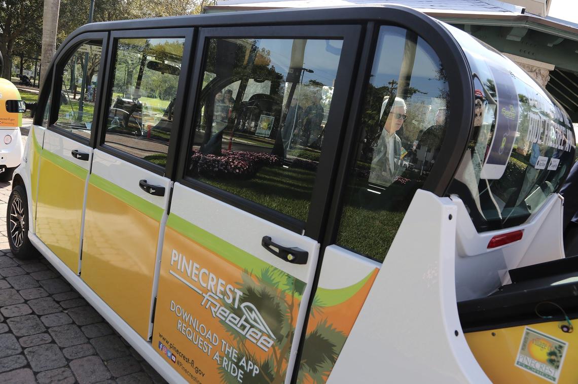 Attendees at the ribbon-cutting ceremony for Pinecrest’s “Freebee” shuttle got a chance to inspect the electric cars Wednesday.