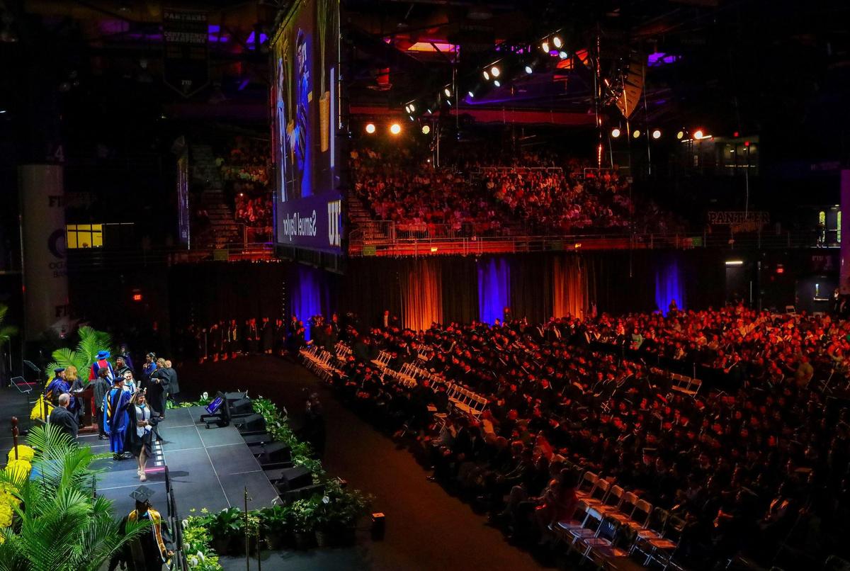 A panoramic view of a commencement ceremony, the second of 10, at Ocean Bank Convention Center at the Modesto A. Maidique Campus on Sunday, April 30, 2023.