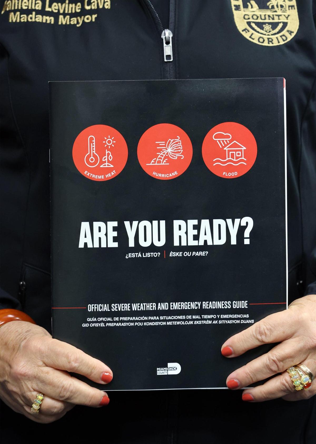 County Mayor Daniella Levine Cava holds a mailer for Miami-Dade residents during a press conference on May 15, 2025, at the Miami-Dade County Emergency Operations Center in Doral, Florida. 
