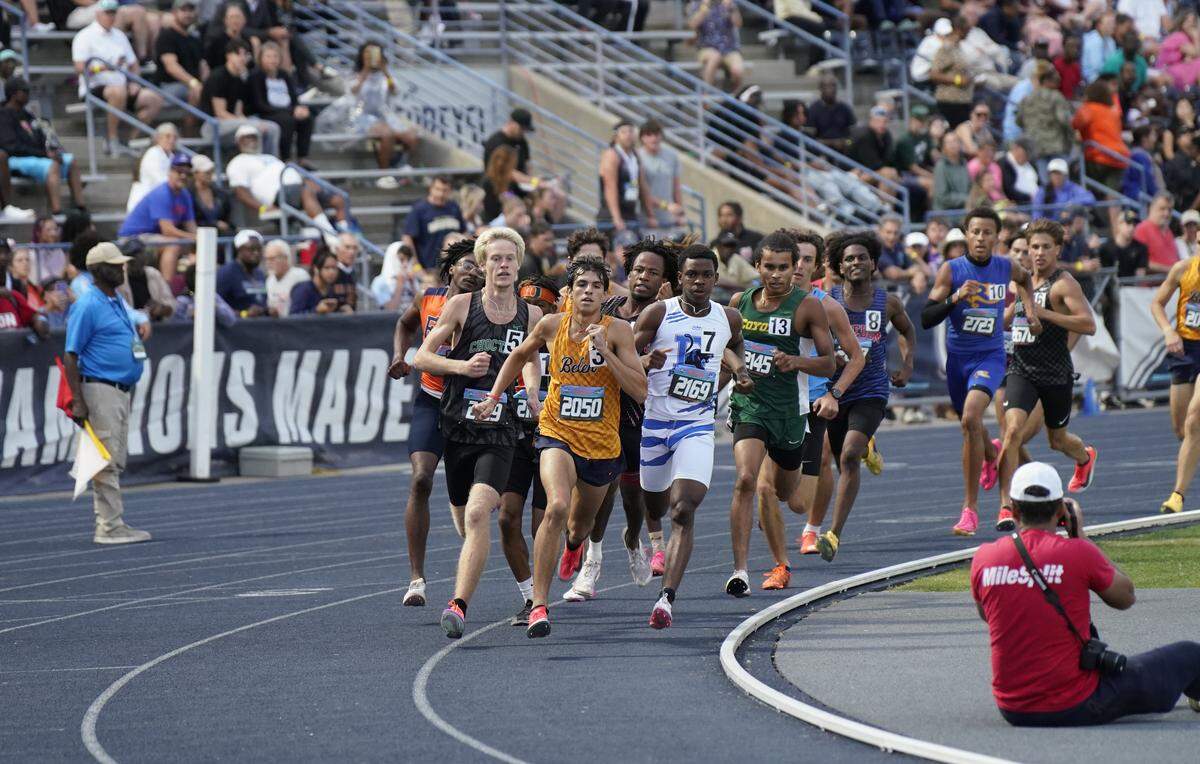 Belen Jesuit’s Marcelo Mantecon (yellow jersey) runs in the 800 meter race on Friday at the Class 3A state championships at the University of North Florida’s Hodges Stadium in Jacksonville.