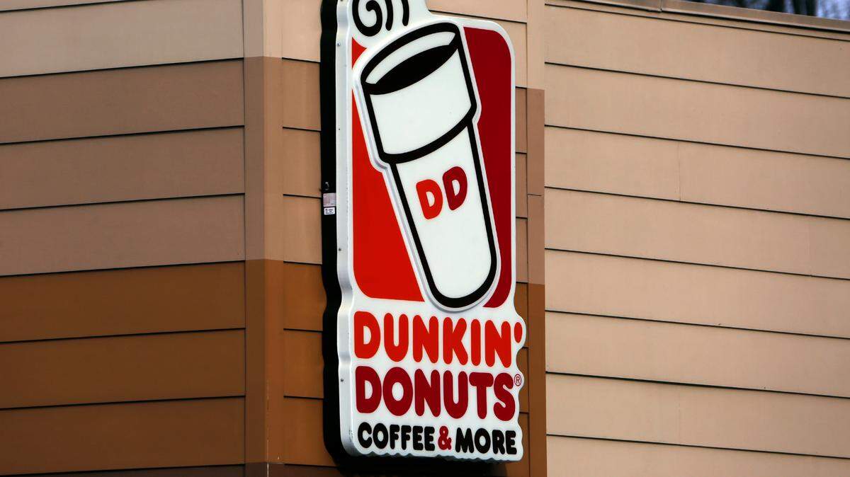 This is the Dunkin’ Donuts logo on a shop in Mount Lebanon, Pa. Monday, Jan. 22, 2018. (AP Photo/Gene J. Puskar)