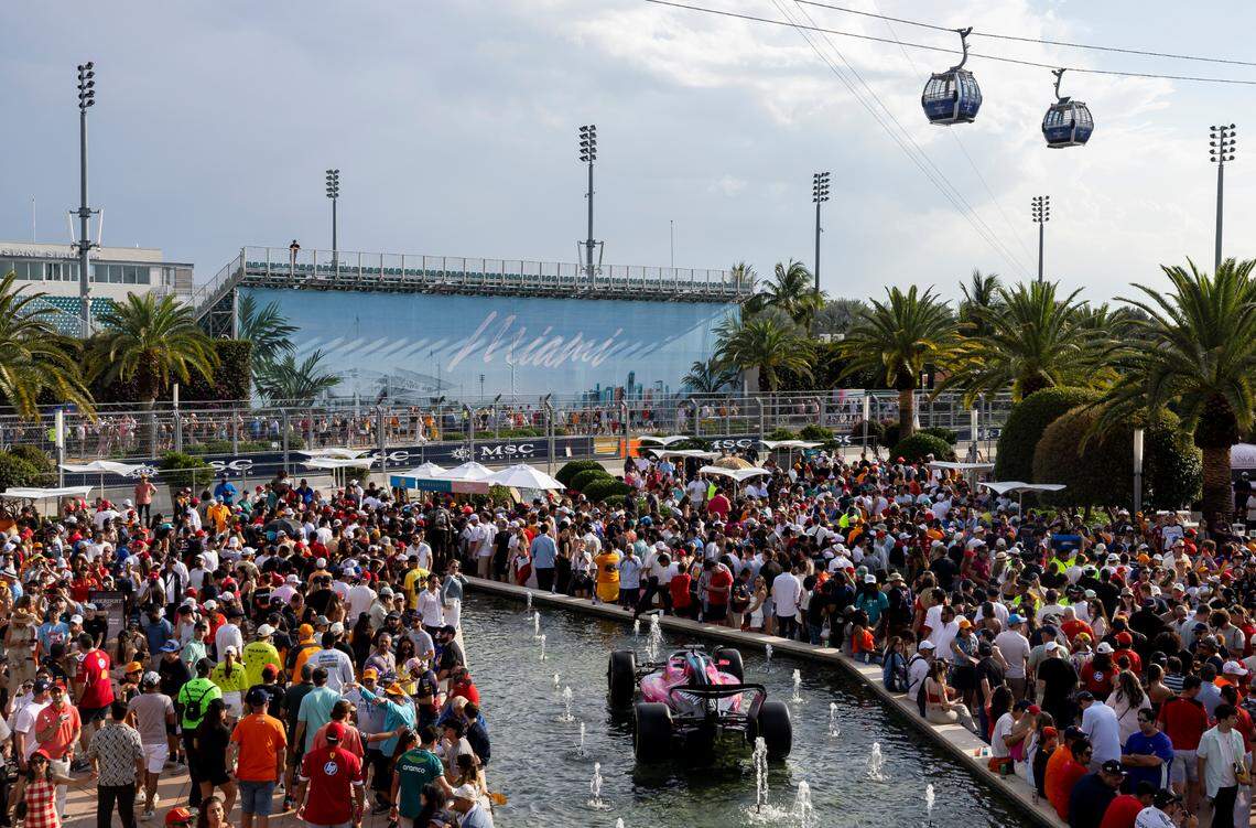 Fans gather to watch the trophy ceremony after McLaren drivers Oscar Piastri of Australia placed first in the Formula One Miami Grand Prix at the Miami International Autodrome on Sunday, May 4, 2025, in Miami Gardens, Fla.