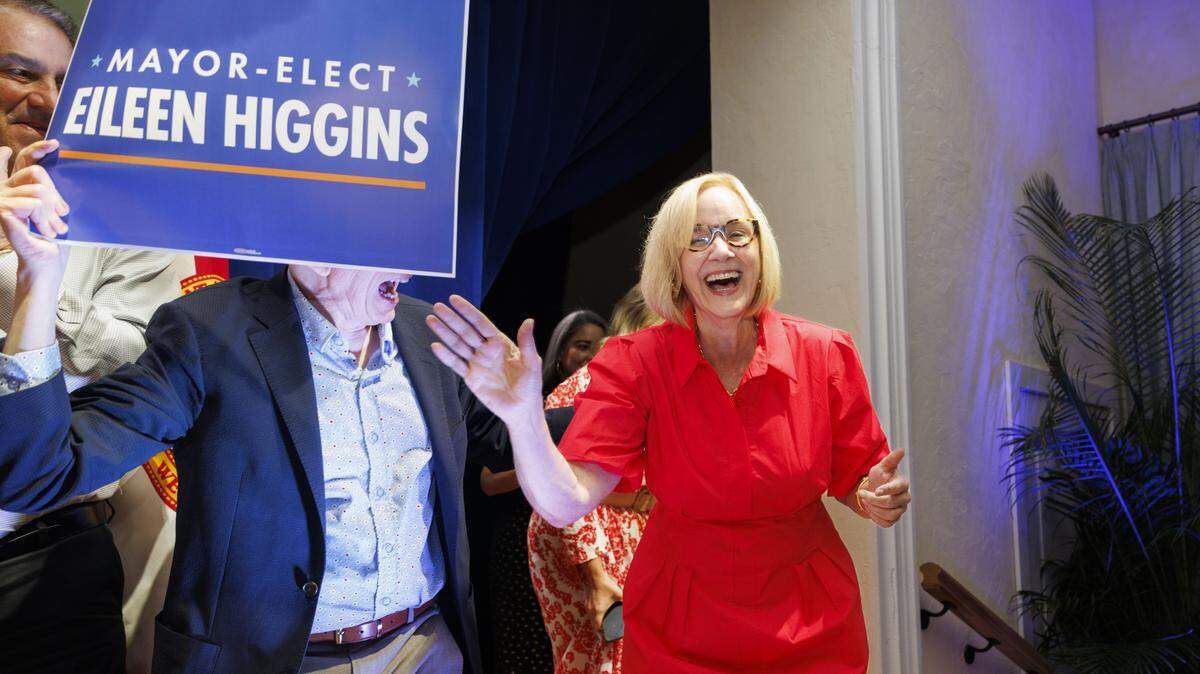 Mayor-elect Eileen Higgins, center, comes out onstage victorious at an election night watch party in the runoff race for Miami mayor on Tuesday, Dec. 9, 2025, at the Miami Women's Club. 