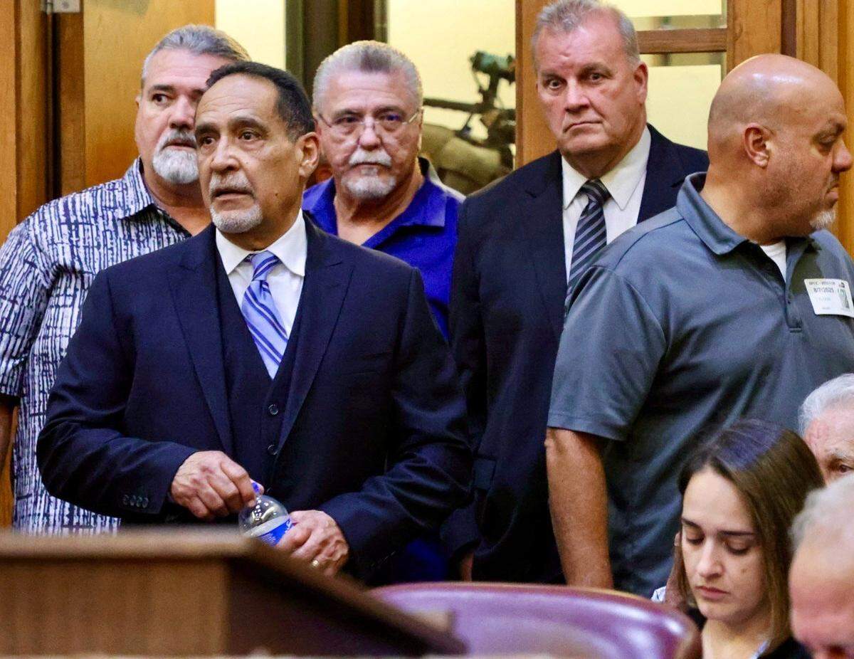 Miami, Florida, August 7, 2025 - Former Commissioner Joe Martinez, left, walks into the courtroom for his sentencing.