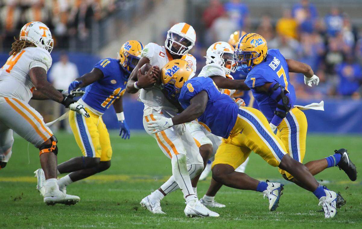 Hendon Hooker (5) of the Tennessee Volunteers gets sacked by Calijah Kancey (8) of the Pittsburgh Panthers during the second half at Acrisure Stadium in Pittsburgh, PA on Spetmebr 10, 2022. Pittsburgh Panthers Vs Tennessee Volunteers