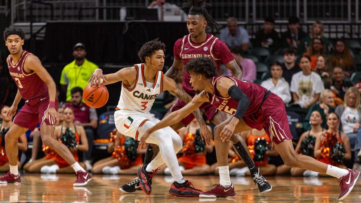 Miami (Fl) Hurricanes guard Jalil Bethea (3) dribbles while defended by Florida State Seminoles guard Daquan Davis (5) during the first half of an NCAA basketball game at Watsco Center on Wednesday, January 8, 2025, in Coral Gables, Fla.