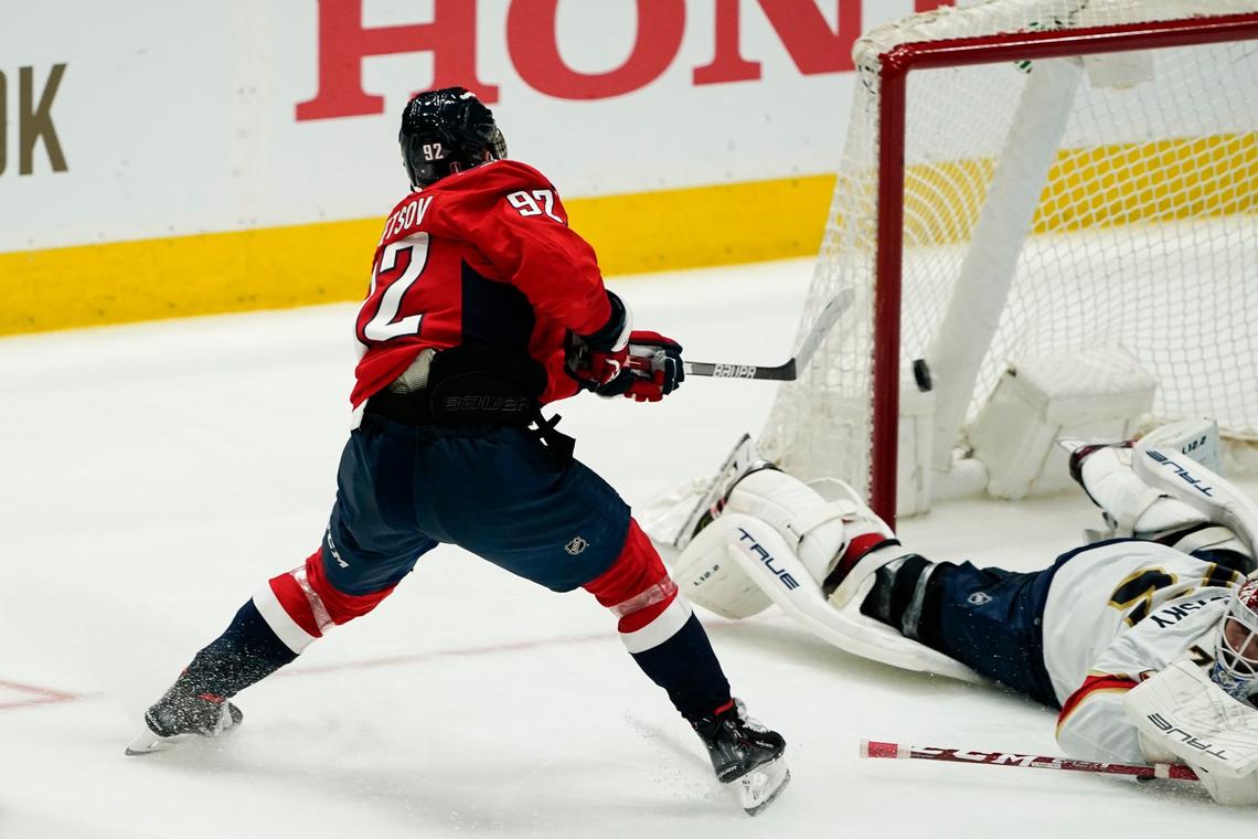 Washington Capitals center Evgeny Kuznetsov (92) scores a goal over Florida Panthers goaltender Sergei Bobrovsky (72) during the third period of Game 4 in the first round of the NHL Stanley Cup hockey playoffs, Monday, May 9, 2022, in Washington. (AP Photo/Alex Brandon)