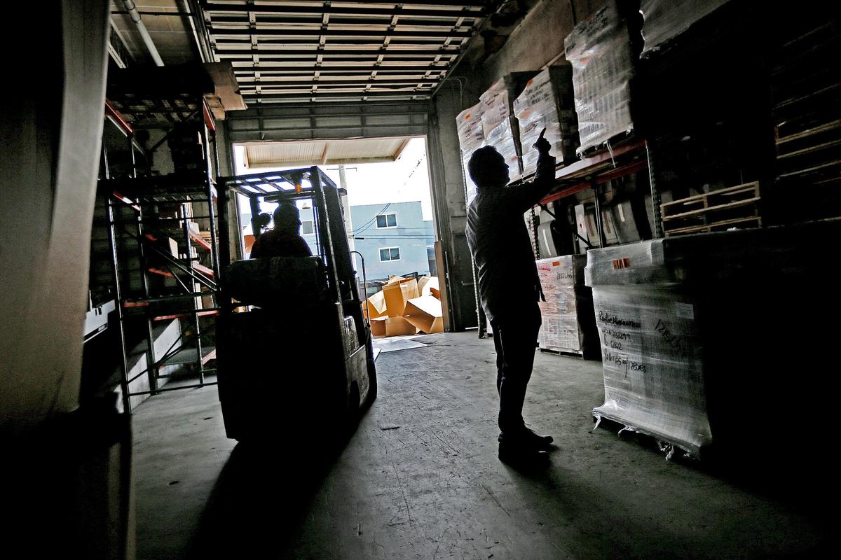 Kevin Feig, vice president of Foreign Parts Distributors in Hialeah, points out products and their ultimate destinations  in a company warehouse on Sept. 5, 2018.  Kevin and his father, Steve Feig, the company president, talked about how their business will suffer under tariffs slapped on by the Trump administration.