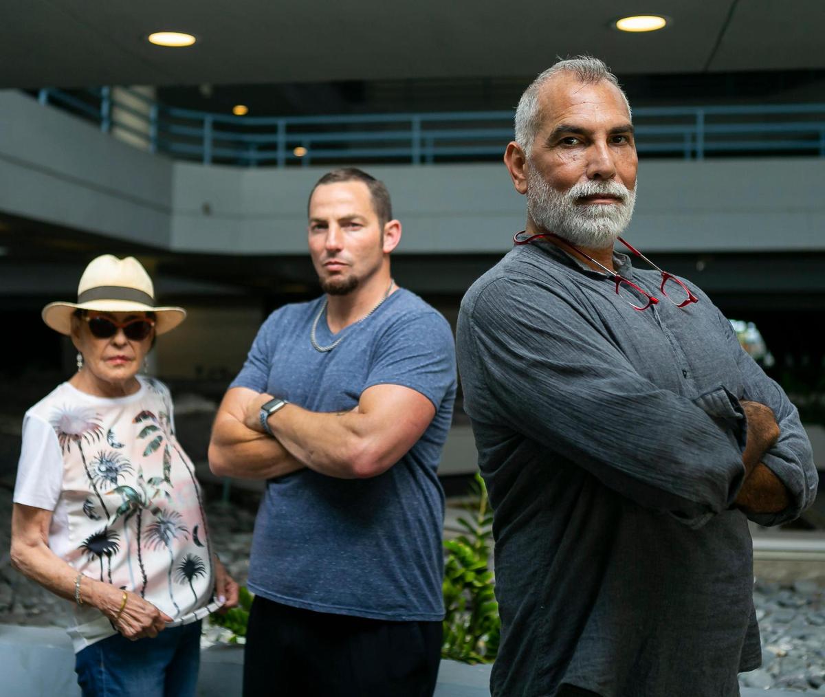 From left to right: Sandra Ross, Greg Frank and Osvaldo Perez are photographed at the Hamilton on the Bay apartment building in Miami’s Edgewater neighborhood on Tuesday, June 8, 2021. Recently, about 200 residents received an eviction notice to leave their apartments by July 16 so that building renovations could be completed.
