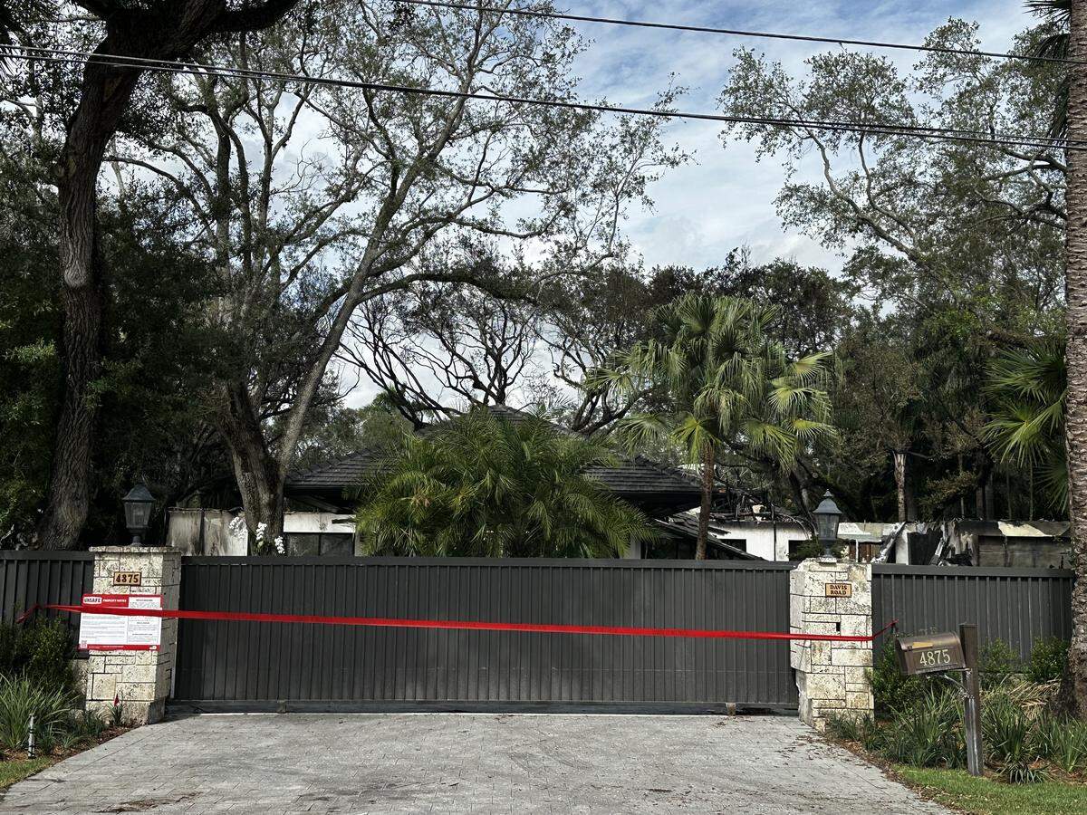 Miami-Dade firefighters cordoned off the front entrance to Miami Heat coach Erik Spoelstra’s house after extinguishing the two-alarm blaze that engulfed the home near Ponce and Davis roads in Miami-Dade County early Thursday morning, Nov. 6, 2025. Noone was injured but it took firefighters about eight hours to extinguish the blaze.