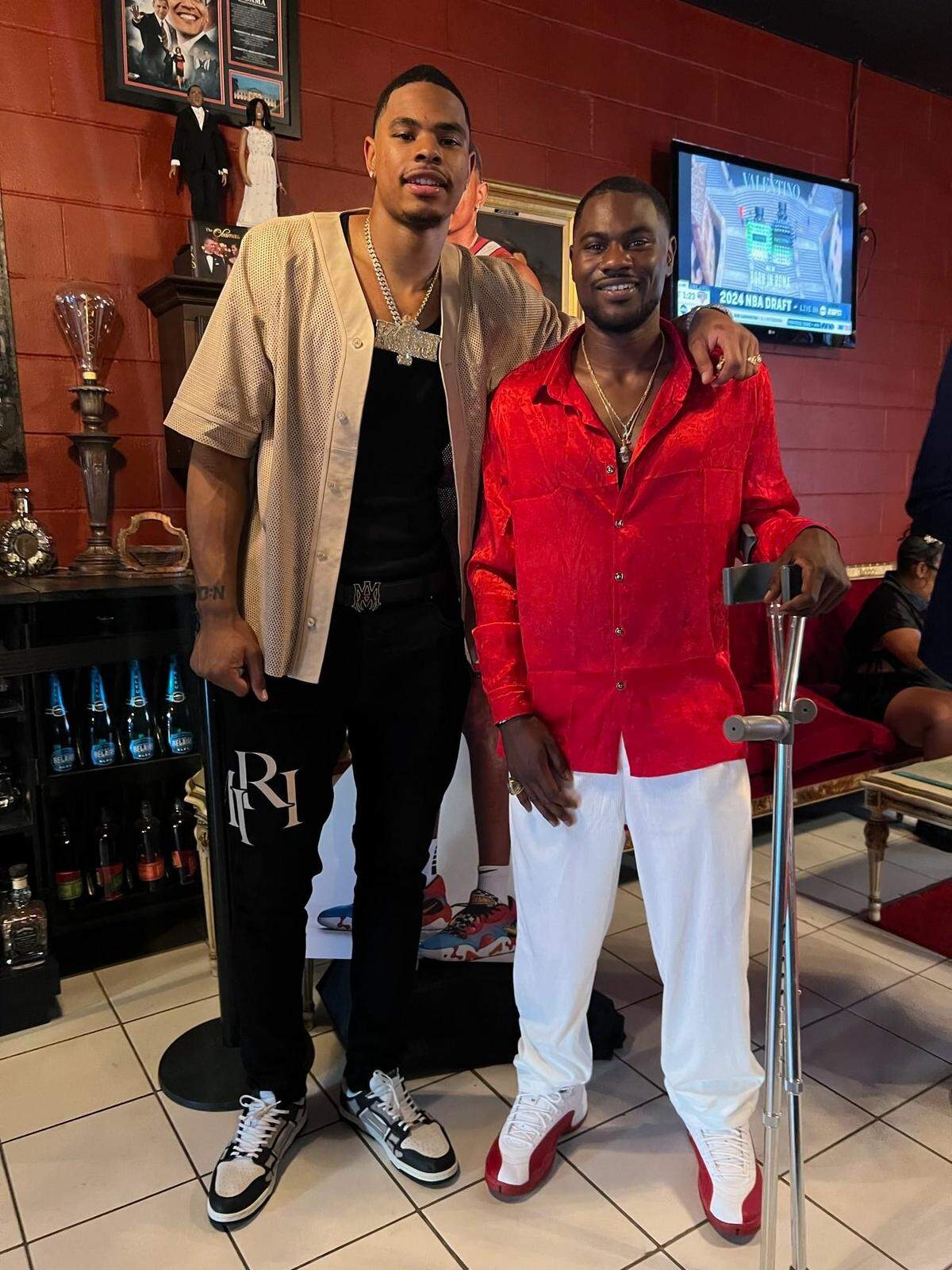 Miami Heat two-way contract player Keshad Johnson stands alongside his older brother, Kenny Johnson.