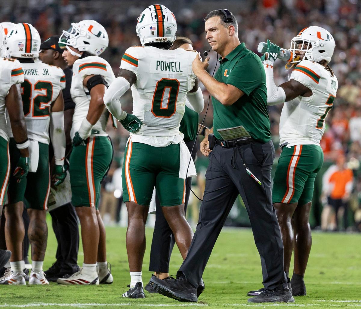 Miami Hurricanes head coach Mario Cristobal is seen on the field during a timeout in the first half of his NCAA college football game against the Miami Hurricanes at the Raymond James Stadium on Saturday, Sept. 21, 2024, in Tampa, Fla.