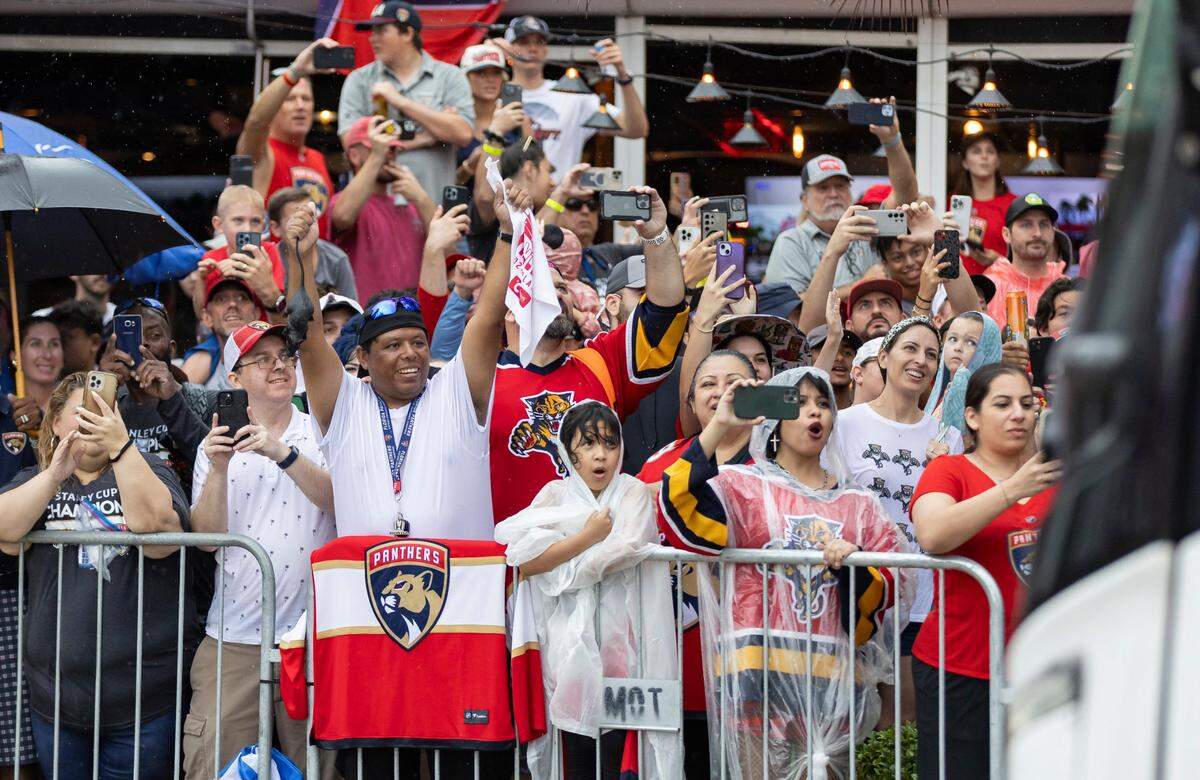Florida Panthers fans react as a team bus makes it way down A1A during a Stanley Cup victory parade at the Fort Lauderdale Beach Park on Sunday, June 30, 2024, in Fort Lauderdale, Fla. The parade was held to celebrate the Florida Panthers after they defeated the Edmonton Oilers in Game 7 of the Stanley Cup Final.