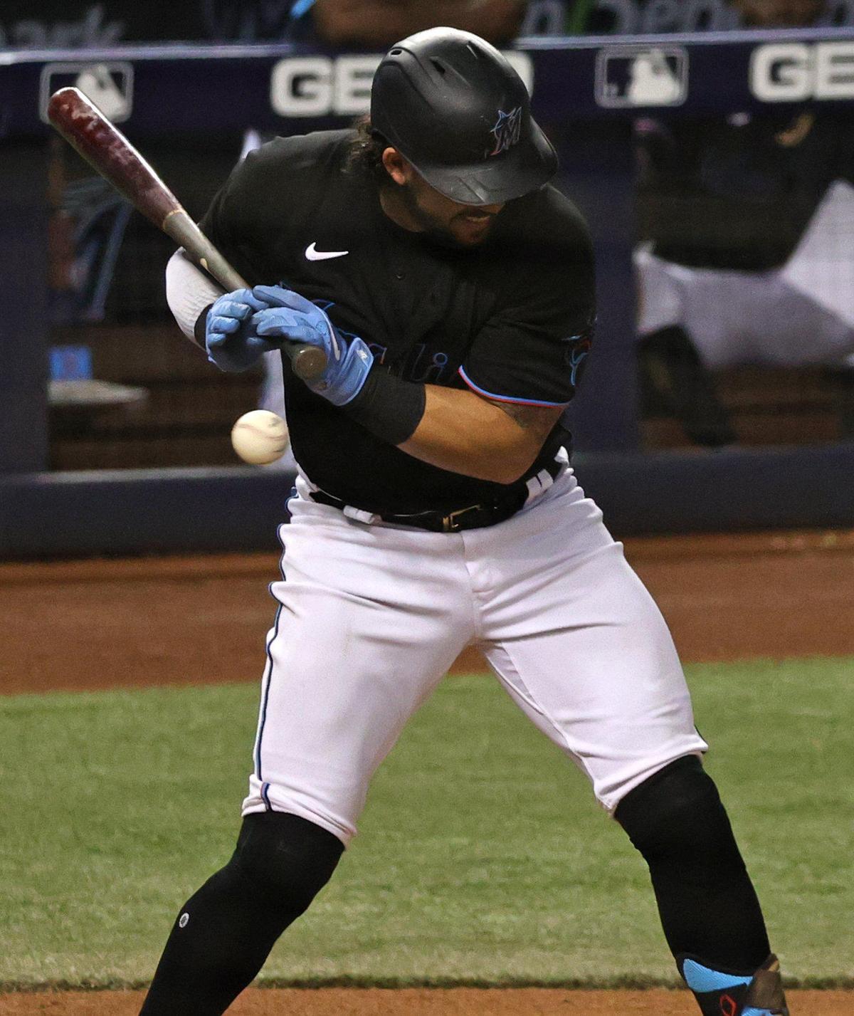 Miami Marlins catcher Jorge Alfaro (38) hit by a pitch by Atlanta Braves pitcher Charlie Morton (50) during the fourth inning of their baseball game at loanDepot park on Friday, June 11, 2021 in Miami, Florida.