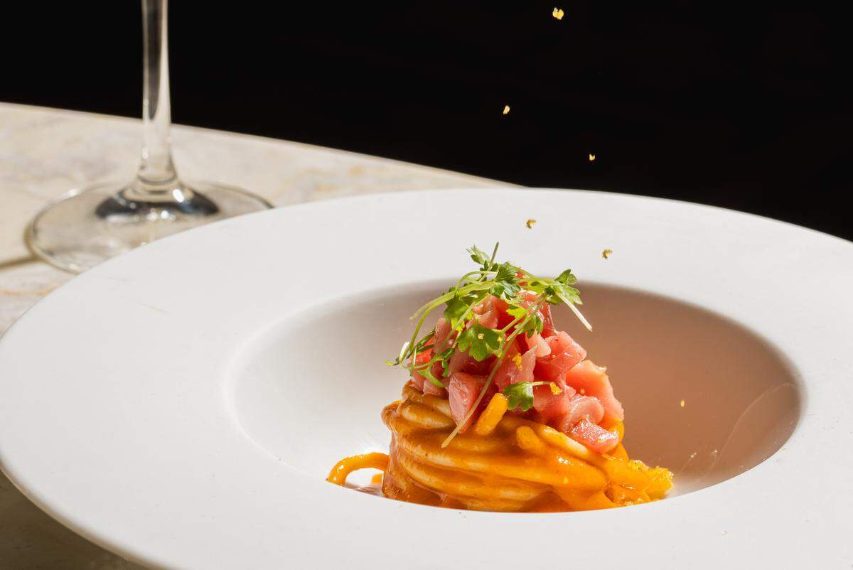 Spaghetto Freddo with tomatoes, tuna, anchovy extract and bottarga.