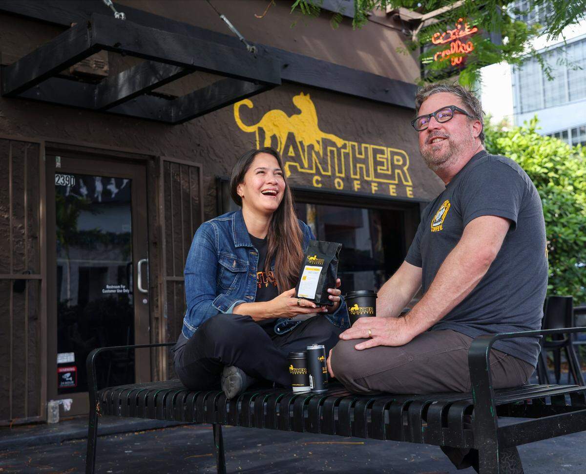 Leticia and Joel Pollack, owners of Miami’s Panther Coffee, outside the original Wynwood cafe. 
