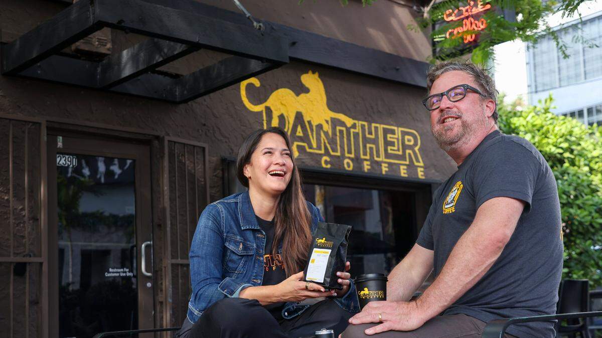 Leticia and Joel Pollock, owners of Miami’s beloved Panther Coffee, outside their Wynwood cafe. Panther celebrates its 15th anniversary this year.