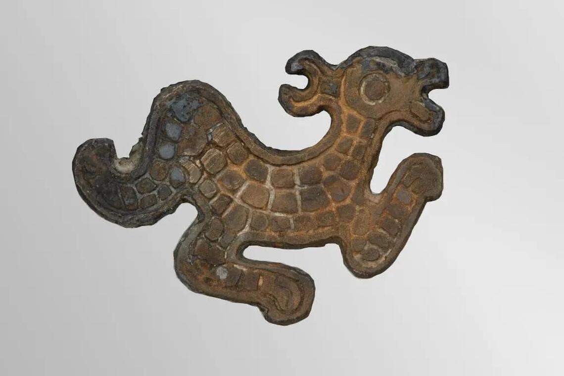 Other bronze objects were found with the swords, including this ornament.