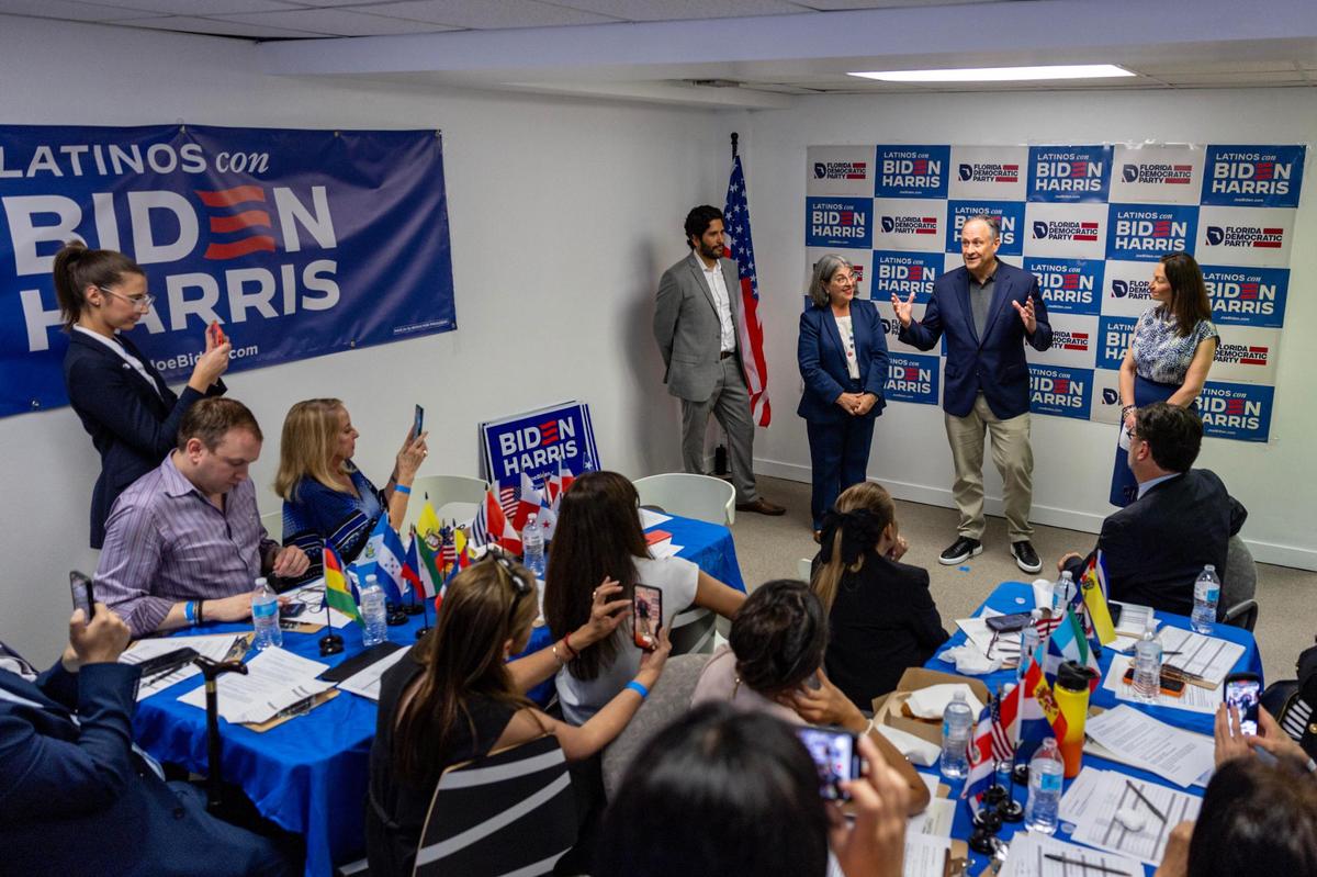 Second Gentleman Doug Emhoff speaks to volunteers for the Biden/Harris campaign alongside chair of the Florida Democratic Party Nikki Fried, right, and Miami-Dade County Mayor Daniella Levine, left, at the opening of the Miami-Dade Democratic Hispanic Caucus Office in Coral Gables, Florida, on Wednesday, March 27, 2024. The visit also highlighted the launch of the campaign’s Latino outreach program in Florida.